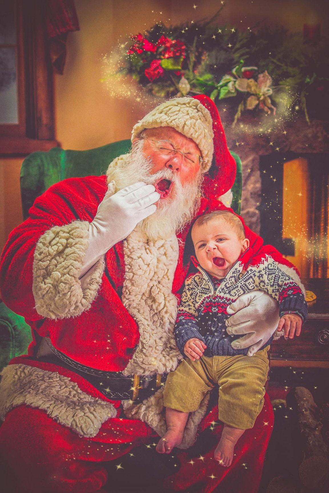 Santa laughing with a baby on his lap