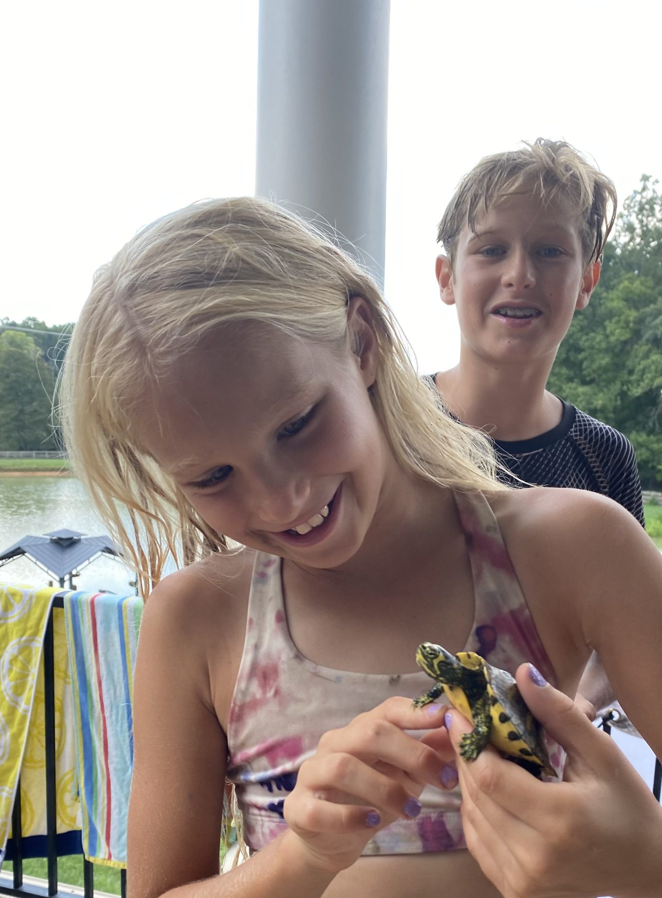 A camper holding a turtle