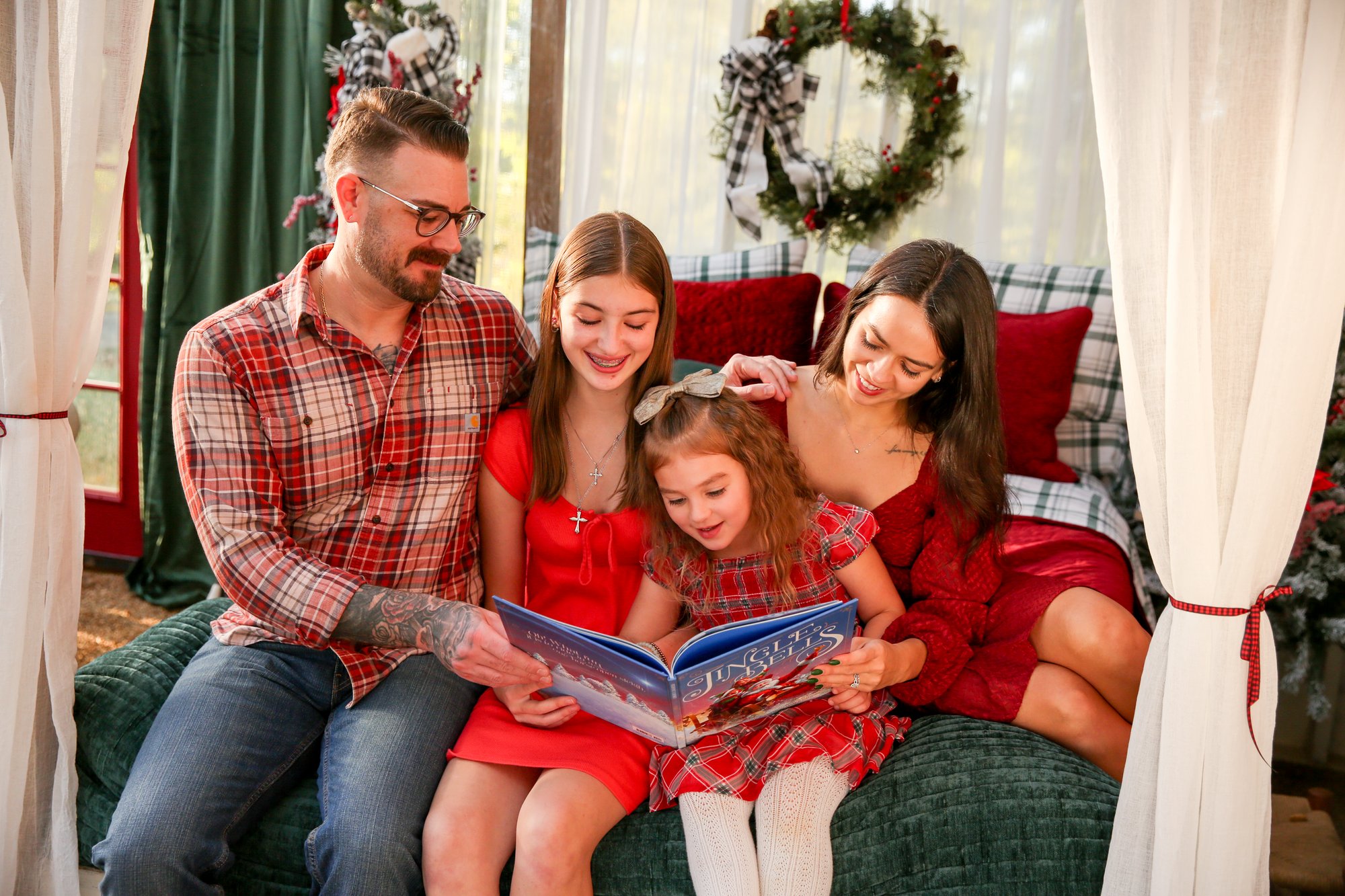 A family sharing a Christmas storybook