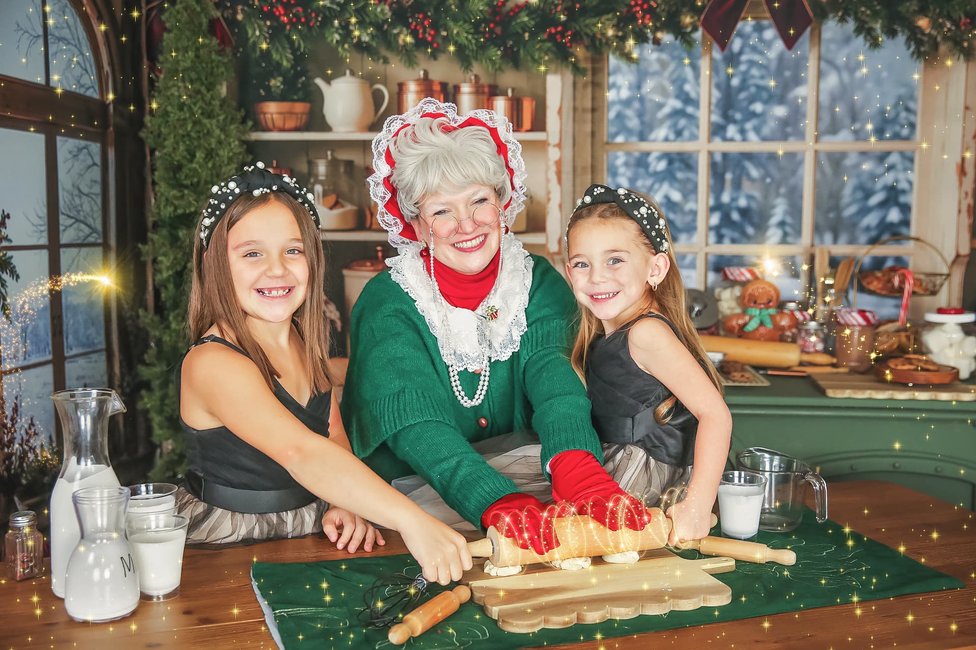 Mrs. Claus and Santa with children at the baking table