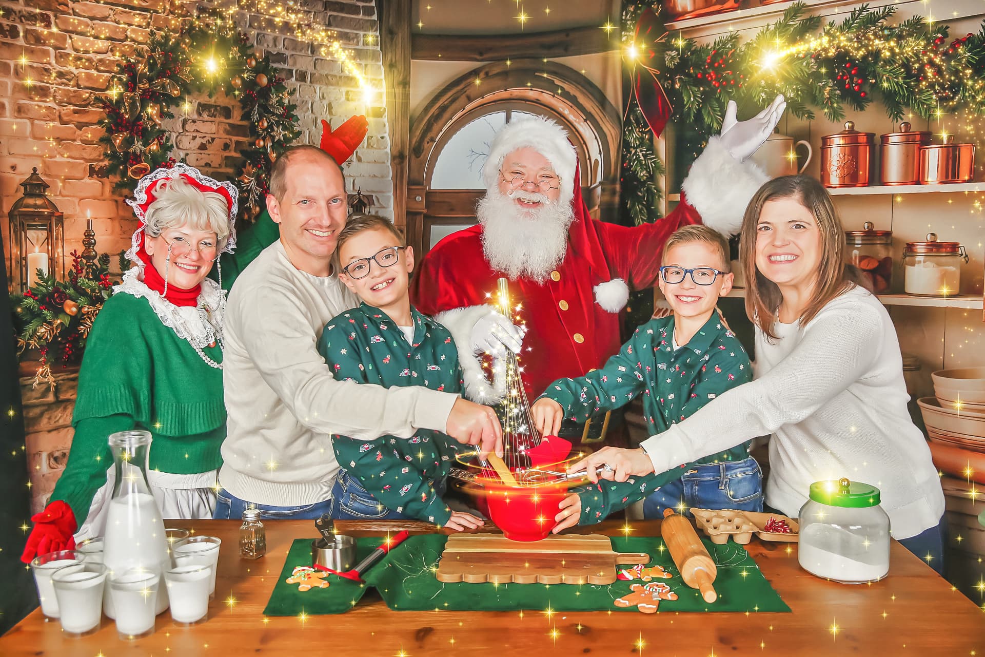 A family whisking up Christmas magic with Santa and Mrs. Claus