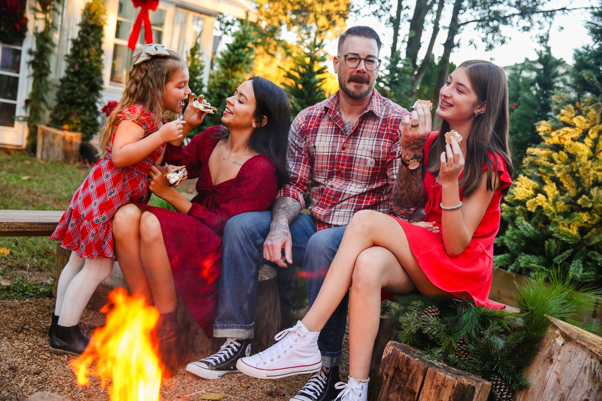 A family enjoying s'mores beside the campfire