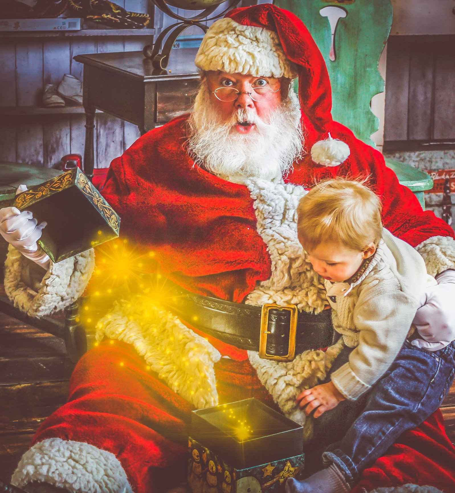 Santa on the farm sharing a Christmas moment with a little one